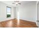 Bright bedroom with ceiling fan, hardwood floors, and large window showcasing city view at 250 Pharr Road Northeast Ne Rd, Atlanta, GA 30305