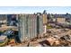 Exterior shot of modern high-rise apartment building in an urban setting with other buildings around at 250 Pharr Road Northeast Ne Rd, Atlanta, GA 30305