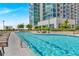 Outdoor swimming pool with lounge chairs in front of modern high-rise building at 250 Pharr Road Northeast Ne Rd, Atlanta, GA 30305