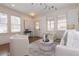 Bright living room featuring hardwood floors, neutral tones, stylish decor, and lots of natural light at 301 Fortune St, Atlanta, GA 30312