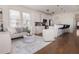 Stylish living room with hardwood floors, modern decor, and an open layout to the kitchen at 301 Fortune St, Atlanta, GA 30312