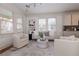 Inviting living room with large windows, neutral color palette, and stylish decor at 301 Fortune St, Atlanta, GA 30312