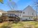 View of backyard featuring a spacious deck and the home's exterior at 31 Mariner Se Way, Acworth, GA 30102