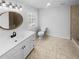 Modern bathroom featuring a vanity with sink, toilet, and tiled shower at 31 Mariner Se Way, Acworth, GA 30102