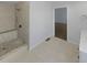 Neutral bathroom featuring a tile shower with seat and white vanity with dark wood countertop at 31 Mariner Se Way, Acworth, GA 30102