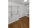 Walk-in closet with custom metal shelving and drawers for organized storage at 31 Mariner Se Way, Acworth, GA 30102