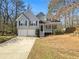 Charming two-story home featuring a two-car garage and covered front porch at 31 Mariner Se Way, Acworth, GA 30102