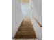 View of wooden stairs with white walls and a light wood handrail at 31 Mariner Se Way, Acworth, GA 30102