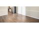 Dining area with wood-look floors next to sliding door to back yard at 3898 Rosedale Ln, Douglasville, GA 30135