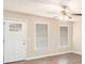 Bright living room featuring hardwood floors, ceiling fan, and a large window at 3898 Rosedale Ln, Douglasville, GA 30135