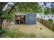 Exterior view of the back of the home showcasing a blue facade and deck with stairs at 198 Scott St Nw, Atlanta, GA 30314