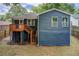 Back exterior view showcasing a wood deck with stairs, blue facade and windows at 198 Scott St Nw, Atlanta, GA 30314