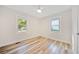 Bright bedroom with modern ceiling fan, hardwood floors and updated windows at 198 Scott St Nw, Atlanta, GA 30314