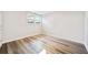 Bedroom with wood floors, white walls, a window and an electrical outlet at 198 Scott St Nw, Atlanta, GA 30314