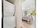 Hallway with stacked washer and dryer near the main bedroom at 198 Scott St Nw, Atlanta, GA 30314