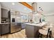 Modern kitchen featuring stainless steel appliances, quartz counters, and an eat-in island at 198 Scott St Nw, Atlanta, GA 30314