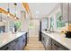 Well-lit kitchen with stainless steel appliances, an island cooktop, and plenty of counter space at 198 Scott St Nw, Atlanta, GA 30314