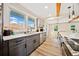 Bright kitchen featuring stainless appliances, gray cabinetry, quartz counters, and hardwood floors at 198 Scott St Nw, Atlanta, GA 30314