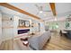 Bright and airy living room with a modern fireplace, wood beam ceiling, and open floor plan at 198 Scott St Nw, Atlanta, GA 30314