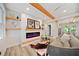 Cozy living room featuring a shiplap fireplace, floating shelves, and a comfortable sofa at 198 Scott St Nw, Atlanta, GA 30314