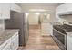 This kitchen features stainless steel appliances, granite countertops, and white cabinets at 2725 Saint Augustine Se Trl, Marietta, GA 30067