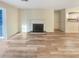 Spacious living room with fireplace and sliding glass doors, complemented by modern flooring at 2725 Saint Augustine Se Trl, Marietta, GA 30067