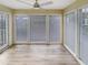 Bright sunroom filled with windows and a ceiling fan, ideal for relaxing or enjoying the natural light at 2725 Saint Augustine Se Trl, Marietta, GA 30067