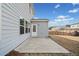 Backyard view with a large concrete patio and rear entry door at 442 Payne Rd, Woodstock, GA 30188