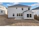 View of the backyard with a concrete patio, level lawn, and neutral color palette on the siding at 442 Payne Rd, Woodstock, GA 30188