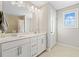 Bright bathroom features double sink vanity with modern hardware and neutral walls at 442 Payne Rd, Woodstock, GA 30188