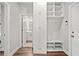 Functional entryway featuring built-in storage, a bench, and a view into the powder room at 442 Payne Rd, Woodstock, GA 30188