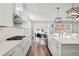 Bright kitchen with stainless steel appliances, a gas stove, and a view into the dining area at 442 Payne Rd, Woodstock, GA 30188