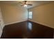 Cozy bedroom with hardwood floors, a ceiling fan, and a large window at 61 Denton Ct, Acworth, GA 30101