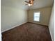 Bedroom featuring beige walls, carpeted floors, and a ceiling fan at 61 Denton Ct, Acworth, GA 30101