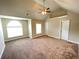 Bedroom featuring beige walls, carpeted floors, and a window at 61 Denton Ct, Acworth, GA 30101