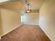 Bright bedroom featuring beige walls, carpeted floors, and a ceiling fan at 61 Denton Ct, Acworth, GA 30101