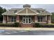 Community clubhouse featuring covered porch, wood columns, and double door entry at 61 Denton Ct, Acworth, GA 30101