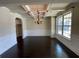 Elegant dining room with coffered ceilings, hardwood floors, and wainscoting at 61 Denton Ct, Acworth, GA 30101