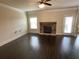 Spacious living room with a stone fireplace, hardwood floors, and a ceiling fan at 61 Denton Ct, Acworth, GA 30101