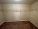 Walk-in closet with ample storage space and carpet floors at 61 Denton Ct, Acworth, GA 30101