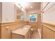 Cozy bathroom features paneled walls, granite countertops, and a tub and shower combo at 4149 Indian Lake Cir, Stone Mountain, GA 30083