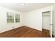 Bedroom with hardwood floors, natural light, and a closet at 4149 Indian Lake Cir, Stone Mountain, GA 30083