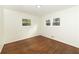 Well-lit room with hardwood floors, and closet at 4149 Indian Lake Cir, Stone Mountain, GA 30083