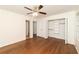 Bedroom with fan, gleaming hardwood floors and closet at 4149 Indian Lake Cir, Stone Mountain, GA 30083