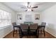 Elegant dining room with modern furnishings, natural light, and hardwood floors at 4149 Indian Lake Cir, Stone Mountain, GA 30083