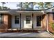 Home's entrance features brick and glass front door at 4149 Indian Lake Cir, Stone Mountain, GA 30083