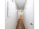 Hallway showing hard wood floors, and access to bedrooms and bathroom at 4149 Indian Lake Cir, Stone Mountain, GA 30083