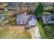 Aerial view of a single-Gathering home with a large yard and mature trees surrounding the property at 629 Granite Ln, Loganville, GA 30052