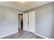 Cozy bedroom featuring gray walls and modern vinyl wood flooring, with a closet at 629 Granite Ln, Loganville, GA 30052