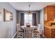 Charming dining area with round table, seating for four, and a stylish light fixture at 629 Granite Ln, Loganville, GA 30052